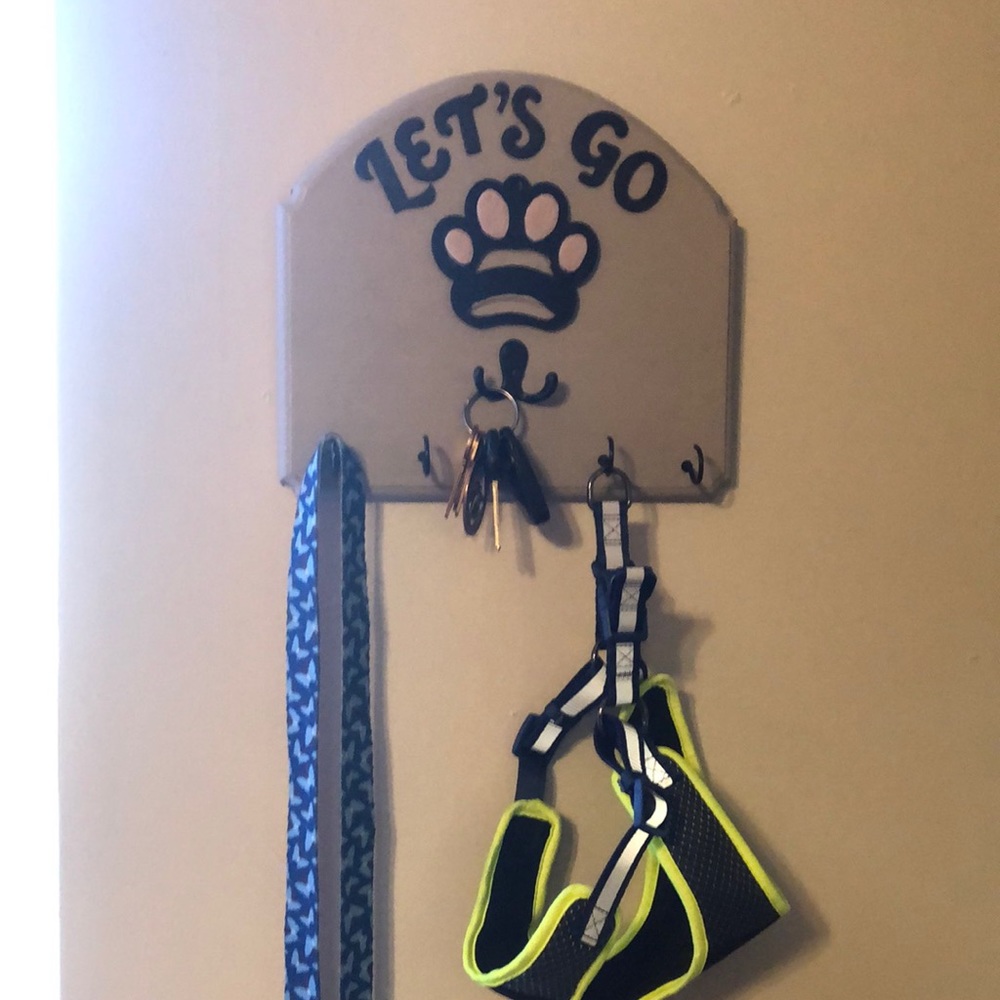 A farmhouse style wood wall hanging for your keys and you pet’s leash!